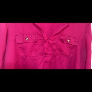 A hot pink blouse